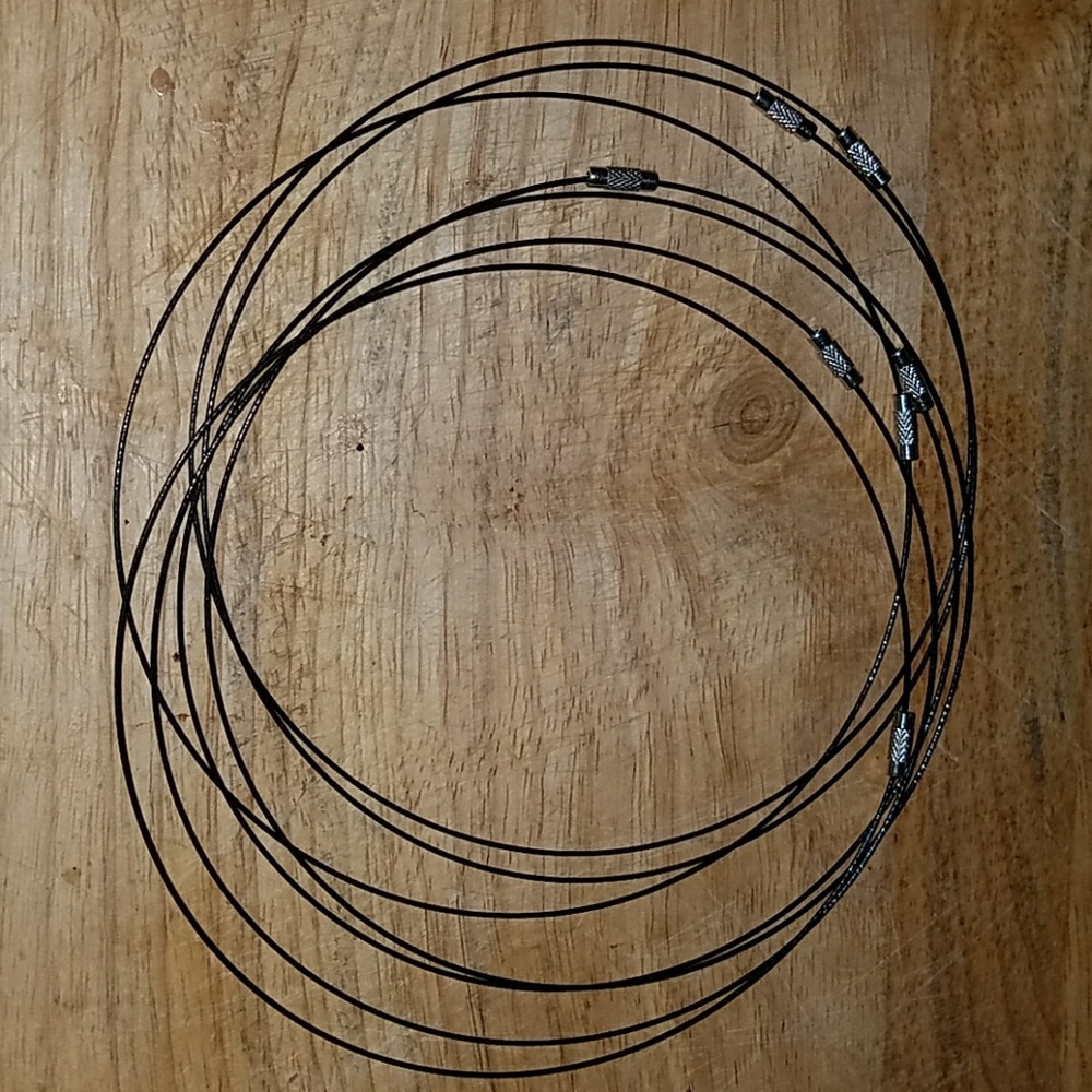 Black twisted wire choker with silver closure.
